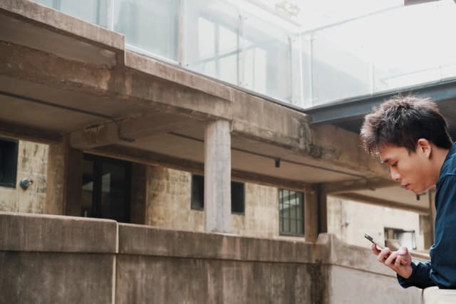 A photo of myself walking in a bamboo forest in Kyoto, Japan.
